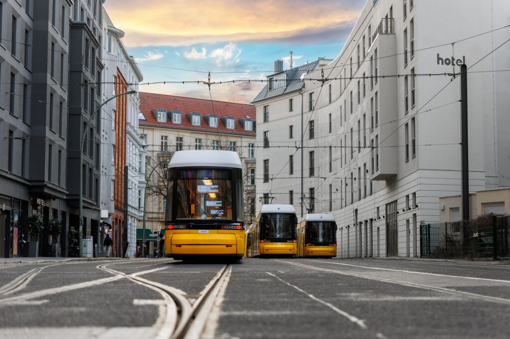 Scenic evening view many modern yellow tram car parked at street station Berlin Mitte central