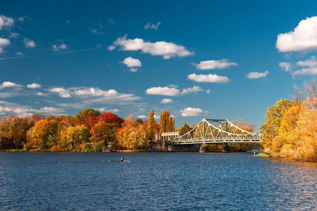 View of Glienicker Brücke or Bridge of Spies in Potsdam Germany in autumn with colorful trees